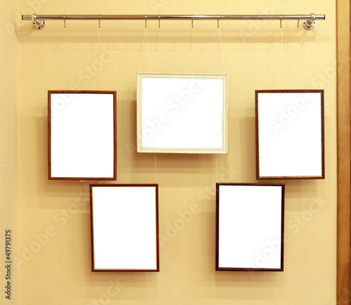 Photo: Five frames with isolated canvas on the exhibition ledge Five frames with isolated canvas on the exhibition ledge