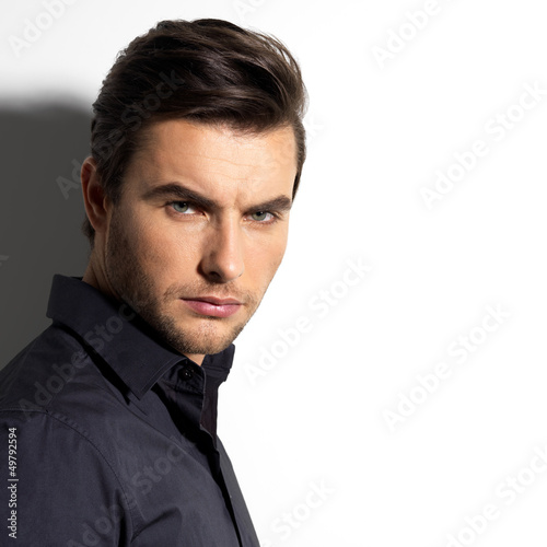 Photo: Fashion portrait of young man in black shirt Fashion portrait of young man in black shirt