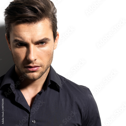 Photo: Fashion portrait of young man in black shirt Fashion portrait of young man in black shirt