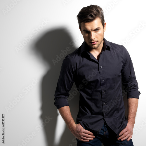 Photo: Fashion portrait of young man in black shirt Fashion portrait of young man in black shirt