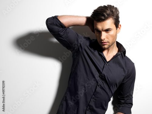 Photo: Fashion portrait of young man in black shirt Fashion portrait of young man in black shirt