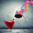 Ballet dancer in flying satin dress with umbrella
