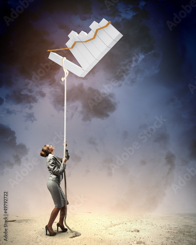 Photo: Image of businesswoman climbing the rope Image of businesswoman climbing the rope
