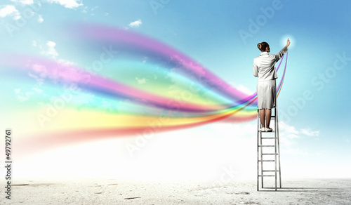 Photo: Young woman drawing splashes Young woman drawing splashes
