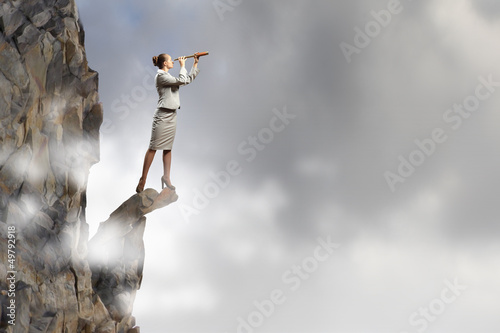 Photo: Business woman with telescope Business woman with telescope