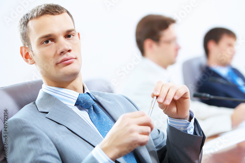 Photo: Three businesspeople at meeting Three businesspeople at meeting