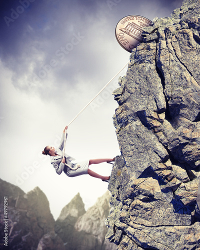 Photo: businesswoman climbing mountain businesswoman climbing mountain