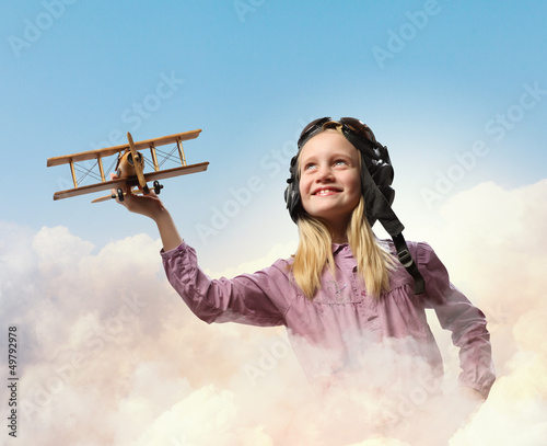 Photo: Little girl in pilot's hat Little girl in pilot's hat