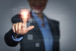 Photo: Business woman touching display Business woman touching display