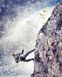 busiessman climbing mountain