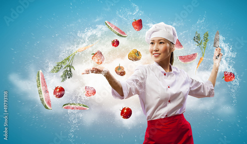 Photo: Asian female cook with knife Asian female cook with knife