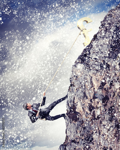 Photo: busiessman climbing mountain busiessman climbing mountain