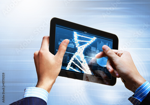 Photo: Dna strand On The Tablet Screen Dna strand On The Tablet Screen