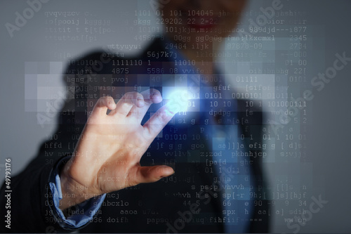 Photo: Business woman touching display Business woman touching display