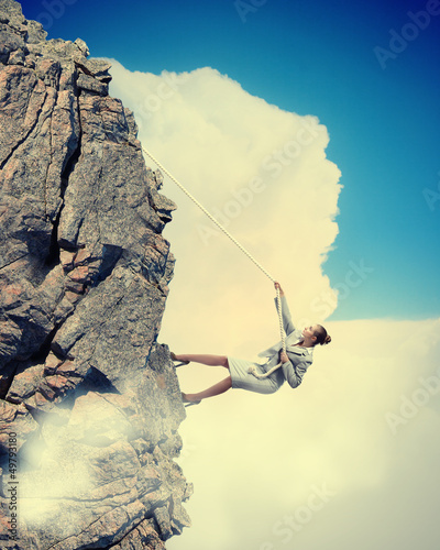 Photo: businesswoman climbing mountain businesswoman climbing mountain