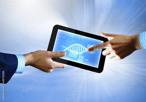 Photo: Dna strand On The Tablet Screen Dna strand On The Tablet Screen