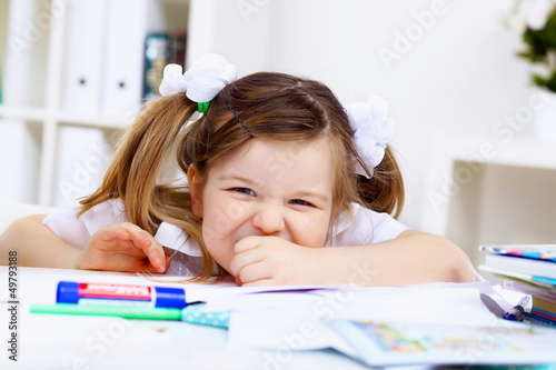 Photo: Little girl and her mother studying Little girl and her mother studying