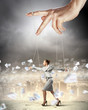Business woman marionette