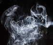 Blue smoke on black background