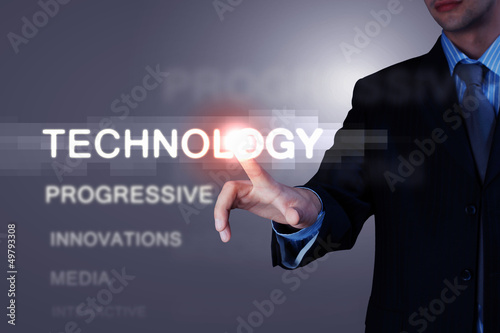 Photo: Business man touching display Business man touching display