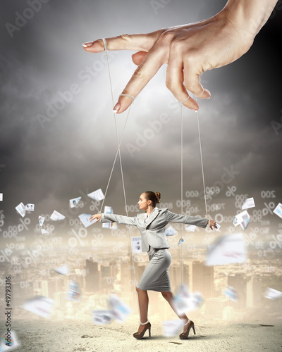 Photo: Business woman marionette Business woman marionette