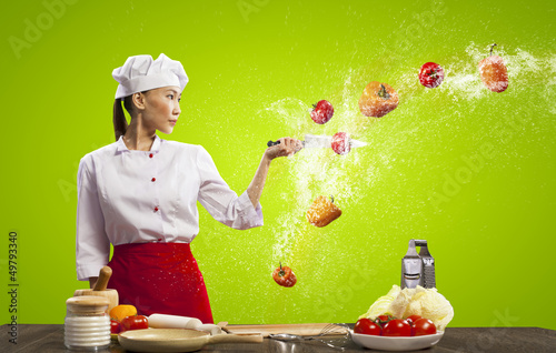 Photo: Asian female cook with knife Asian female cook with knife