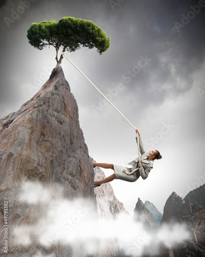 Photo: businesswoman climbing mountain businesswoman climbing mountain
