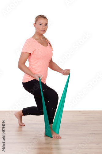 Photo: Athletic woman working out with a strap Athletic woman working out with a strap