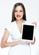 beautiful woman holding tablet pc