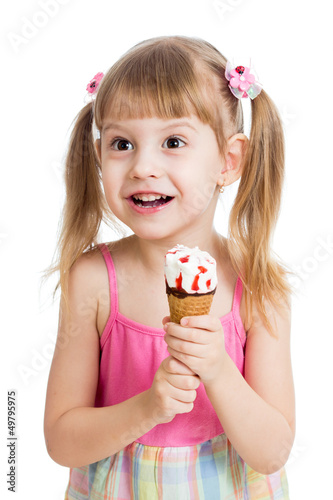 Photo: happy child girl eating ice cream in studio isolated happy child girl eating ice cream in studio isolated