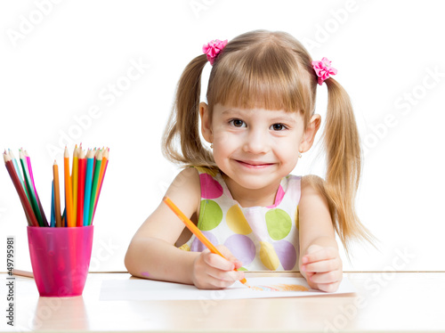 Photo: cute girl drawing with colourful pencils cute girl drawing with colourful pencils