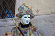 Venetian costume attends Carnival of Venice.