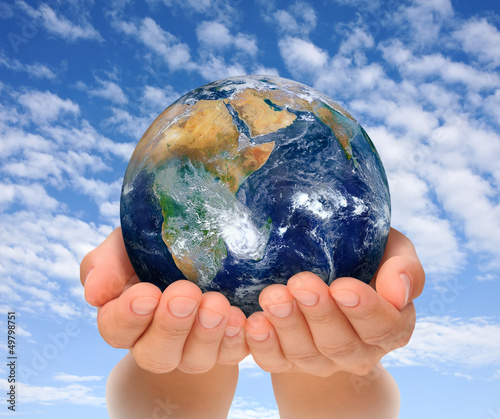 Photo: Hands of woman holding globe, Africa and Near East Hands of woman holding globe, Africa and Near East