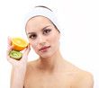 Young woman with fruit.Concept: Facial fruit masks. Isolated