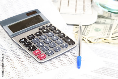 Photo: Financial information and money close-up Financial information and money close-up