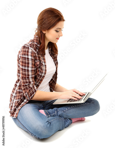 Photo: Beautiful young woman with laptop isolated on white Beautiful young woman with laptop isolated on white