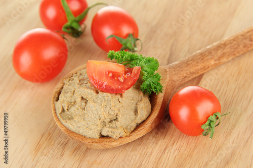 Photo: Fresh pate on wooden spoon, on wooden background Fresh pate on wooden spoon, on wooden background