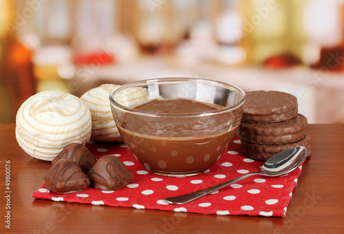 Photo: Bowl of chocolate and sweets on table in cafe Bowl of chocolate and sweets on table in cafe