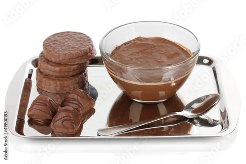 Photo: Bowl of chocolate and sweets isolated on white Bowl of chocolate and sweets isolated on white