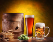 Beer glasses with a wooden barrel.