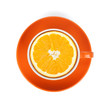 Ripe orange in tea cup