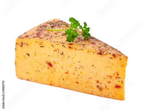 Photo: piece of cheese with spices on a white background piece of cheese with spices on a white background