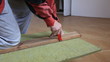Man cutting fiberglass insulation
