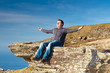 Man at meditation on the Cliffs of Moher - Ireland