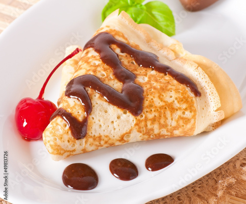 Photo: pancakes with chocolate and cherries pancakes with chocolate and cherries
