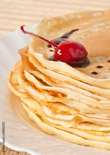 Photo: pancakes with chocolate and cherries pancakes with chocolate and cherries