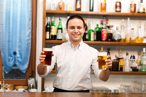 Photo: Bartender offering beers Bartender offering beers