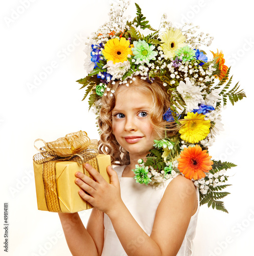 Photo: Child with gift box and flower. Child with gift box and flower.