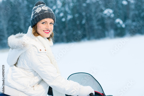 Photo: Woman and snowmobile Woman and snowmobile