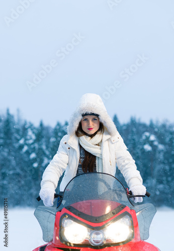 Photo: Woman and snowmobile Woman and snowmobile